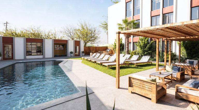 8th street annex pool with lounge chairs and cabana