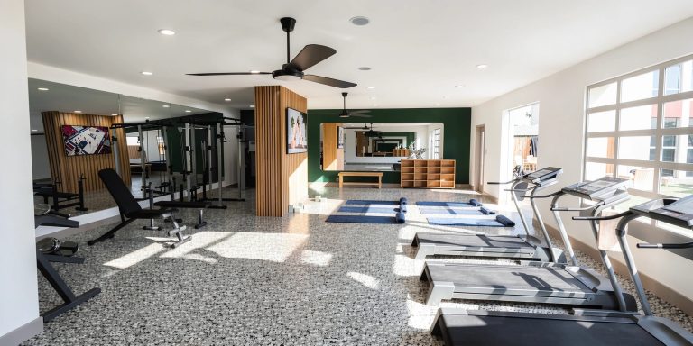 rendering of renovated fitness center with cardio and strength equipment