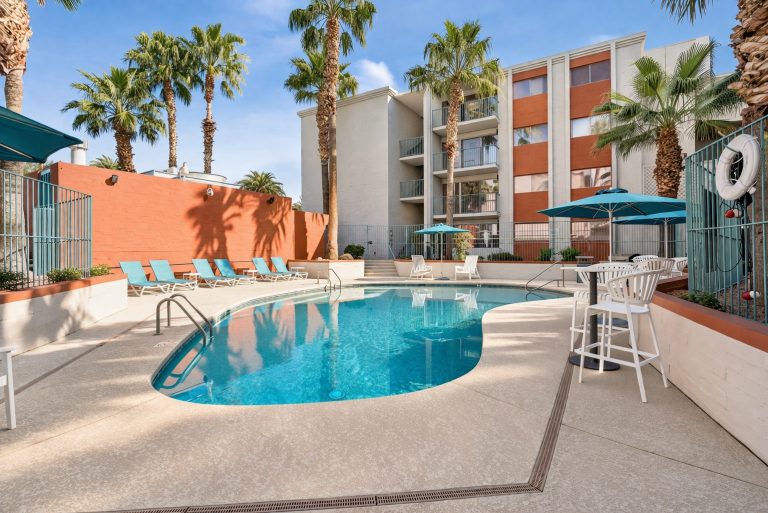 swimming pool and sunny lounge seating at campus crossings on 8th street
